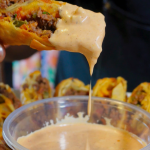 Cheeseburger Egg roll with burger sauce dripping from it