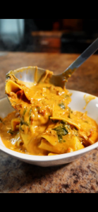 Lasagna soup being ladled into bowl
