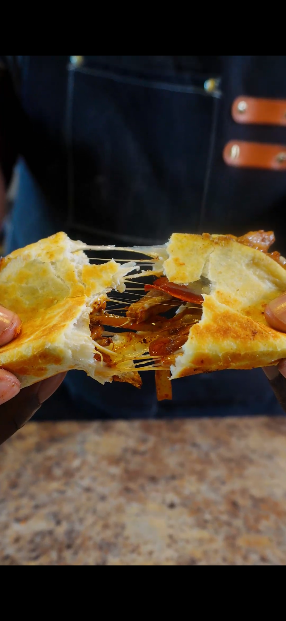 pulling apart chipotle chicken fajita taco