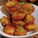 garlic and herb roasted potatoes in a bowl