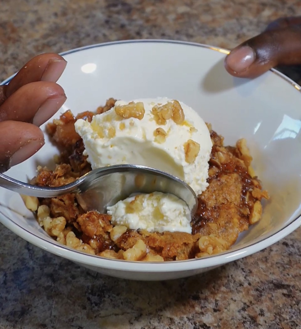 Spooning a scoop of honey apple crisp