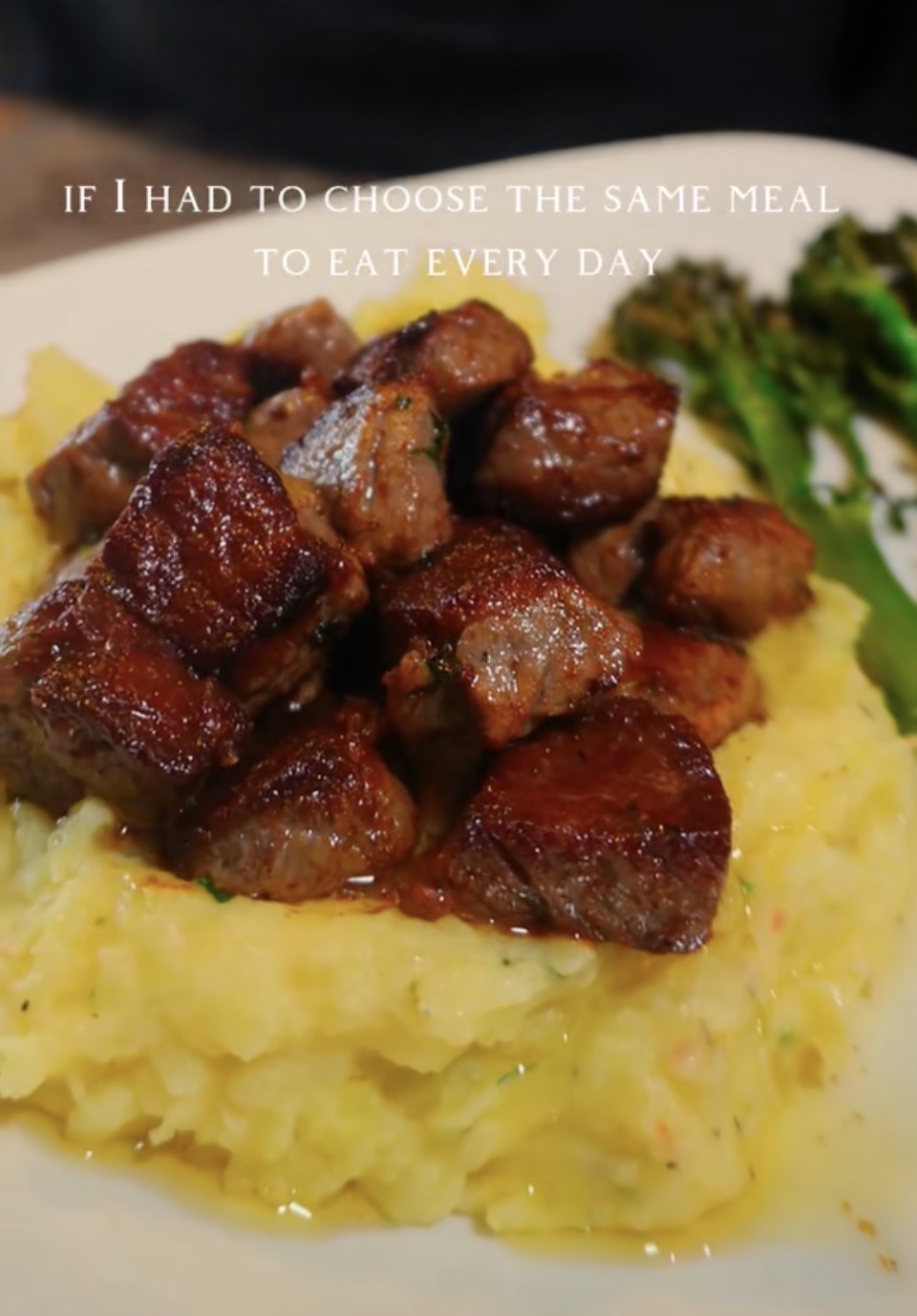 garlic butter steak bites over mashed potatoes