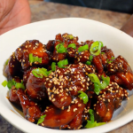 sesame chicken in a bowl