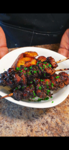 Jerk chicken skewers in a bowl