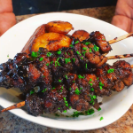Jerk chicken skewers in a bowl