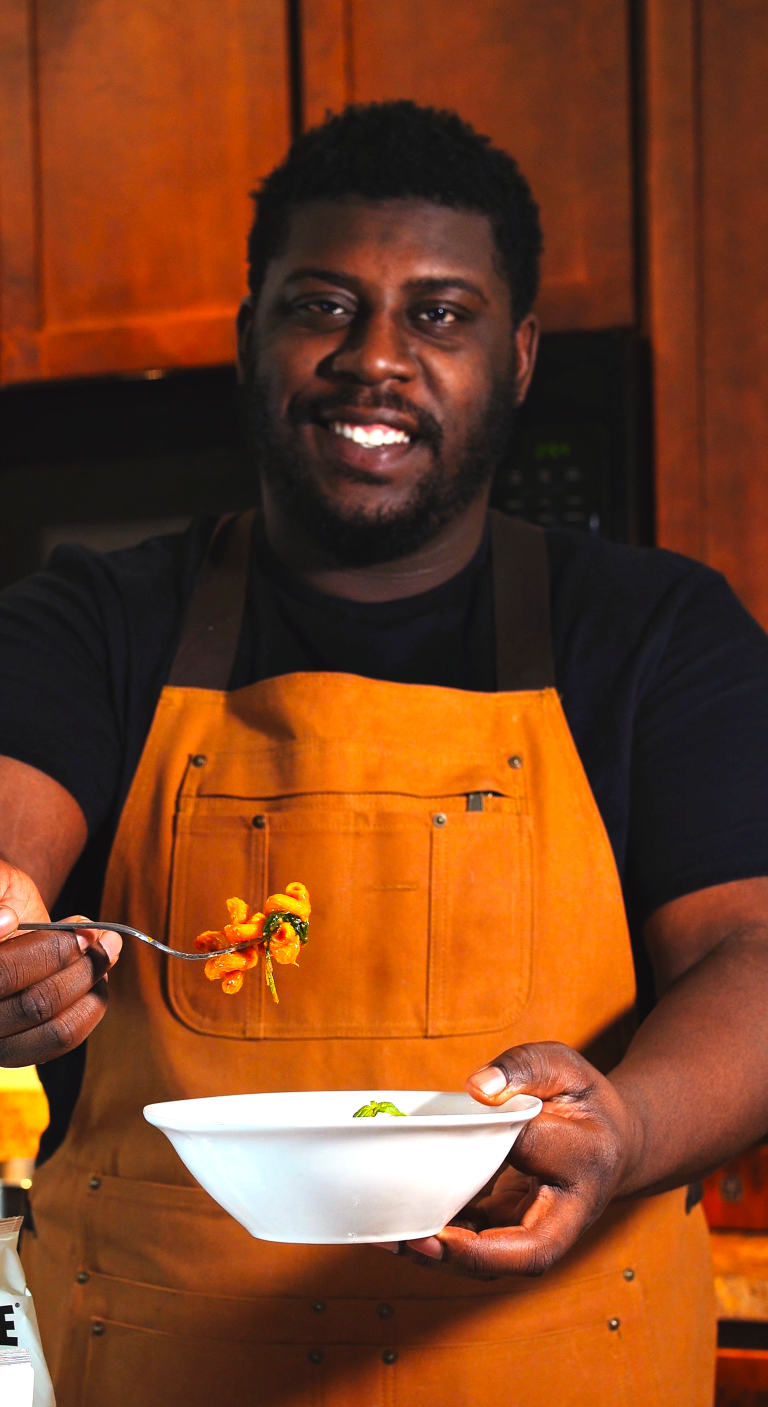 CAMCANCOOK HOLDING A BOWL