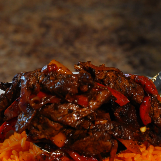 Steak Fajitas over Mexican Rice with Queso