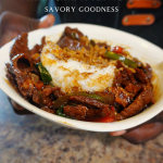 pepper steak over white rice in a bowl