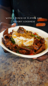 pepper steak over white rice in a bowl