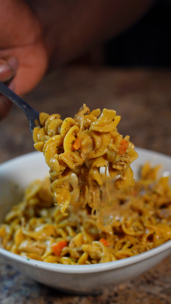 chicken and noodles on a fork