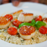 spinach and artichoke risotto with roasted tomatoes and pan seared scallops